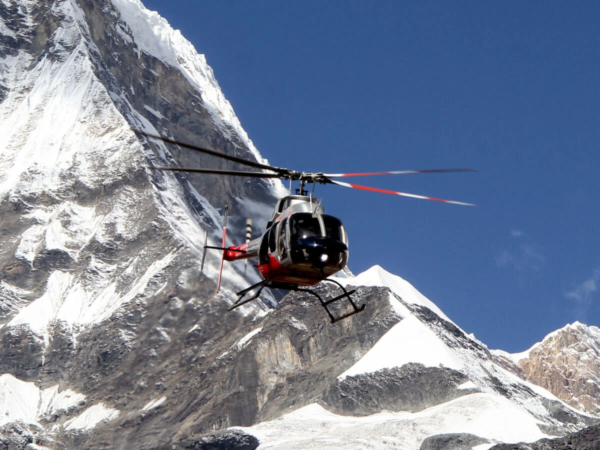 Helicopter Ready to Land at the Himalayas